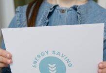 crop photo of a girl holding a slogan on energy saving
