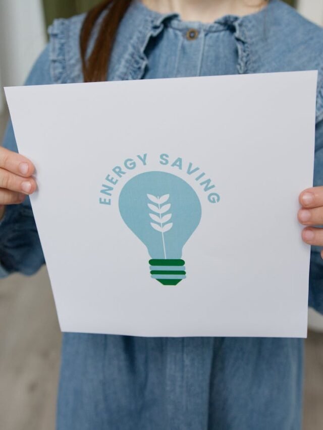 crop photo of a girl holding a slogan on energy saving