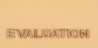 the word evaluation from wooden letters