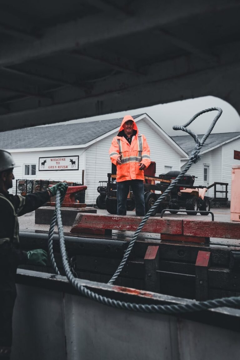 men throwing ropes on shore