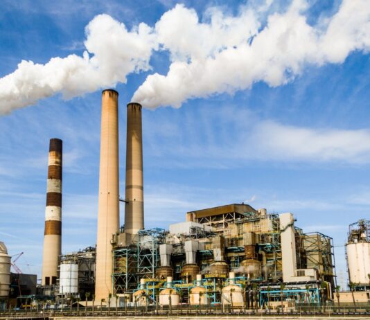photo of an industrial factory emitting smoke