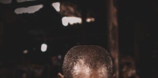 african man cutting board in workshop