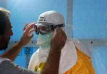 man wearing black goggles and protective suit