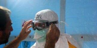 man wearing black goggles and protective suit