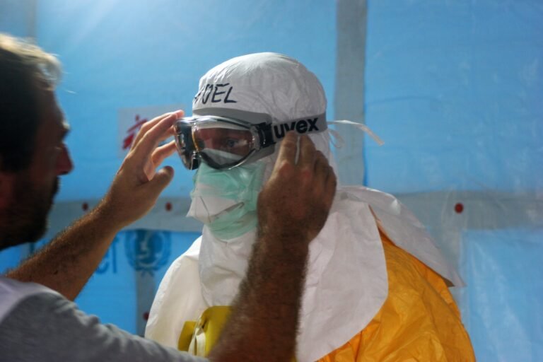 man wearing black goggles and protective suit
