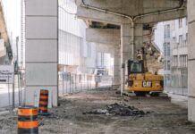under bridge site with heavy machine