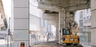 under bridge site with heavy machine
