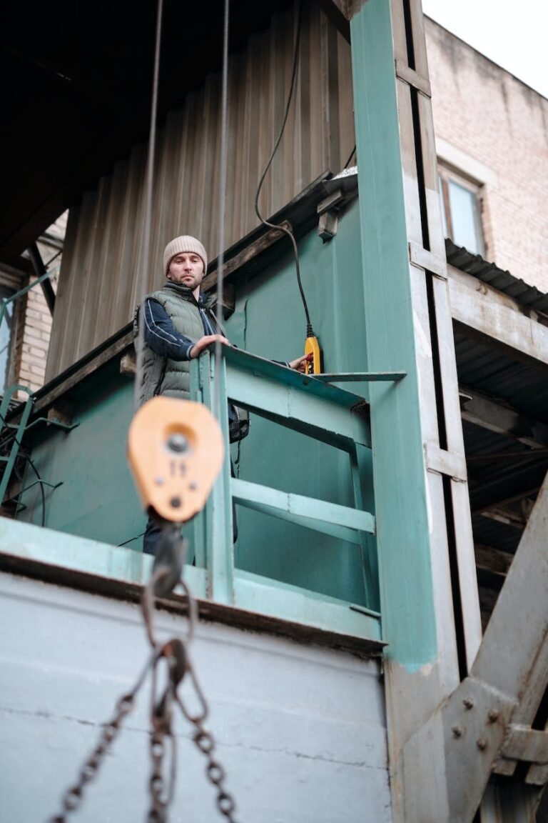 a man in winter jacket working in a warehouse