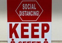 red and white sign on wall