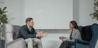 a woman interviewing a man