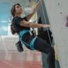 a woman doing wall climbing