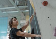 a woman doing wall climbing