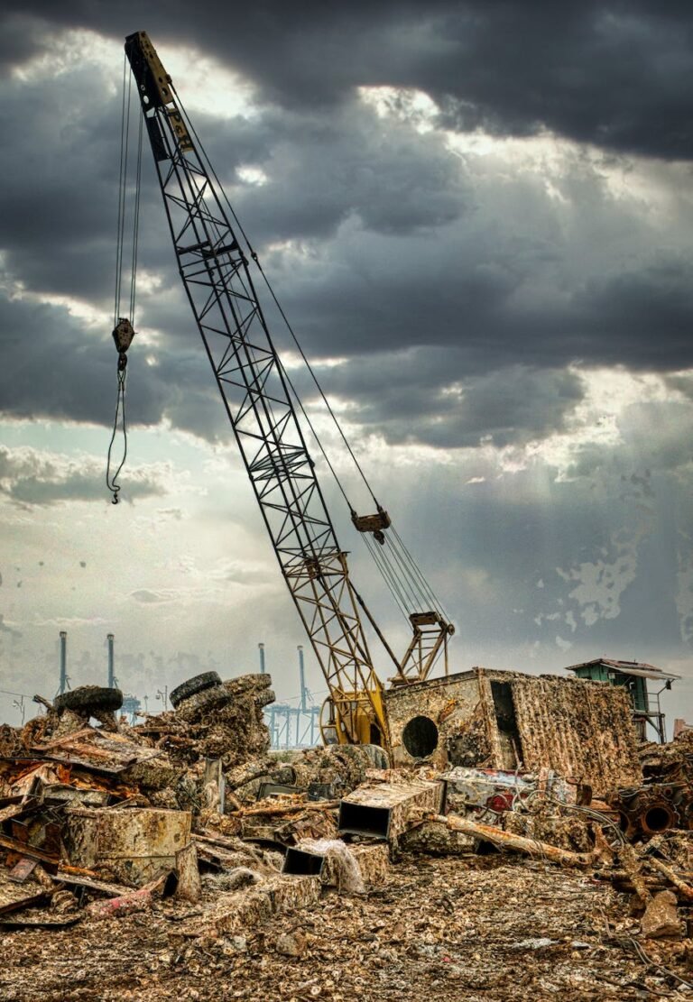 abandoned scrap yard under cloudy sky