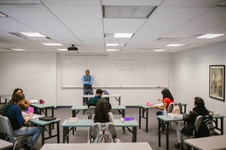 teacher proctoring his students during an examination