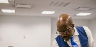 teacher proctoring his students during an examination