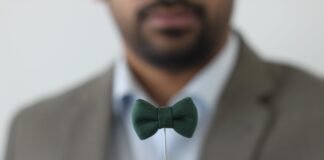 green bow tie forced perspective selective focus photo
