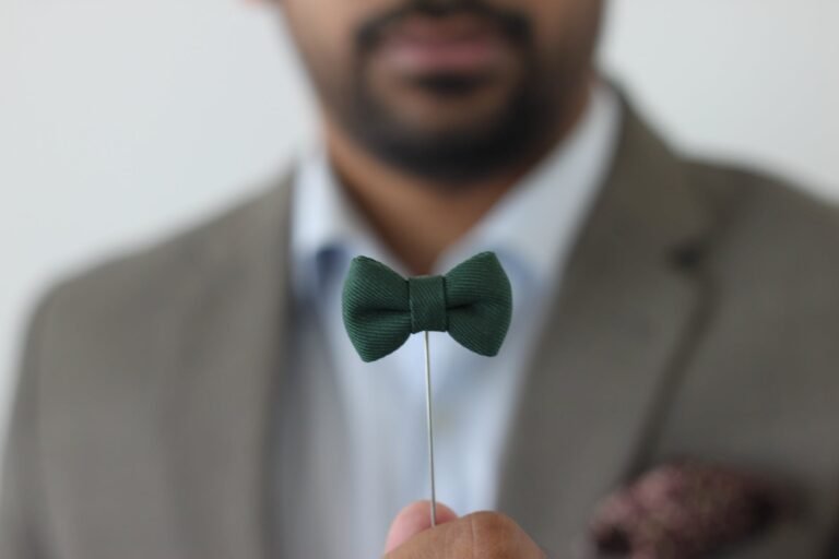 green bow tie forced perspective selective focus photo