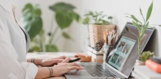 woman working retouching photo on laptop at convenient workplace