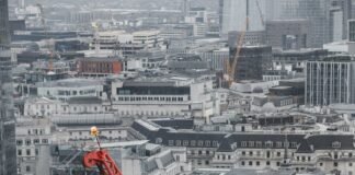 crane and modern building in city district