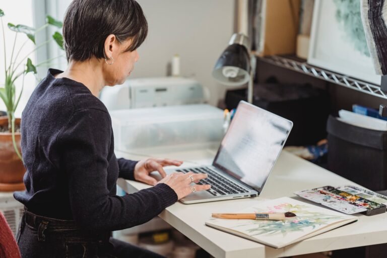 woman browsing the internet by using a laptop