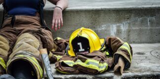 yellow hard hat on brown and yellow fireman s suit