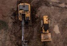 aerial photo of excavator road roller and bulldozer