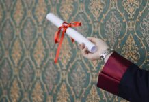 person holding diploma