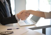 person in black suit hired an employee