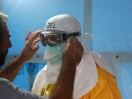 man wearing black goggles and protective suit
