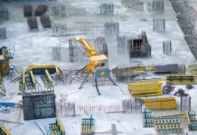 yellow and black heavy equipment on snow covered ground