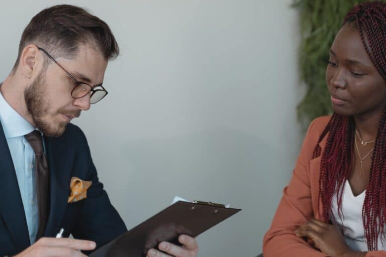 man reviewing woman s resume