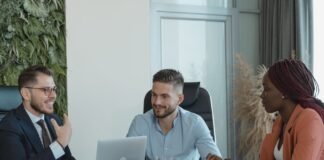 coworkers in a conference room having a meeting