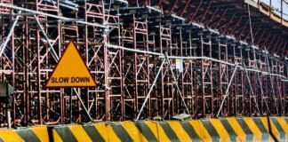 yellow and black road concrete barrier