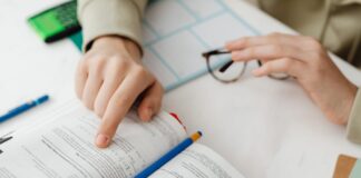 person reading a book and studying