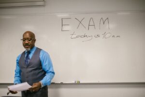 teacher standing by the whiteboard