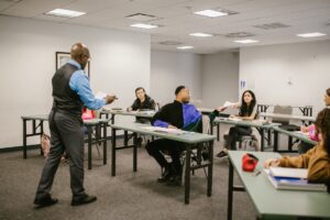 teacher giving the test results to his students