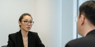 a woman in business attire getting a job interview