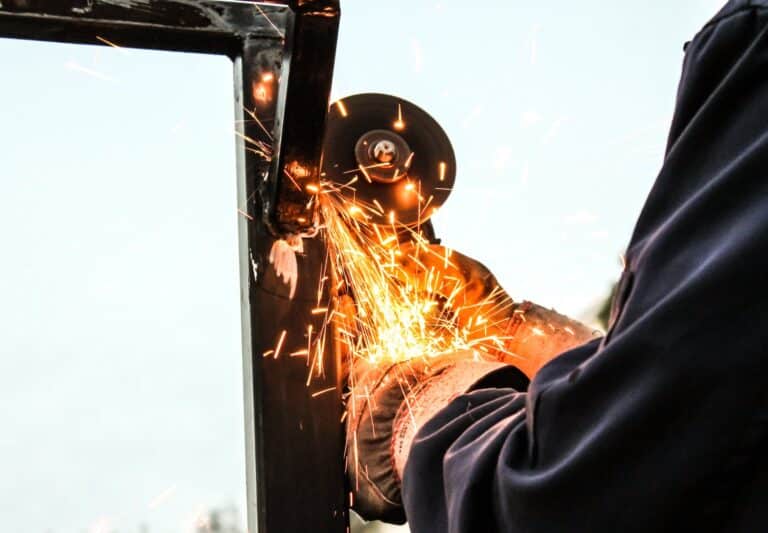 person holding angle grinder