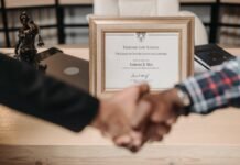 selective focus photo of a diploma on a frame