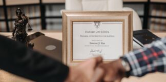 selective focus photo of a diploma on a frame