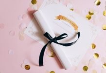 rolled white paper with ribbon on a certificate