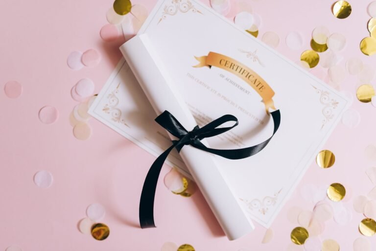 rolled white paper with ribbon on a certificate