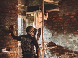 men working on the brick wall