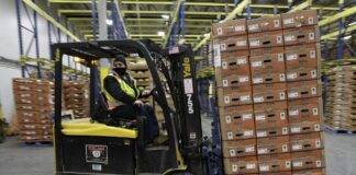 A forklift operator shuttles a pallet