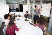 women colleagues gathered inside conference room