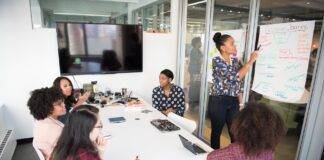 women colleagues gathered inside conference room