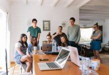 group of people watching on laptop