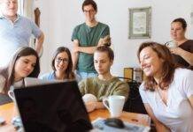 people looking at laptop computer