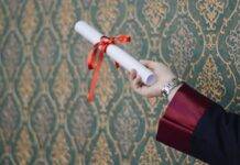 person holding diploma