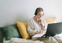 photo of woman taking notes